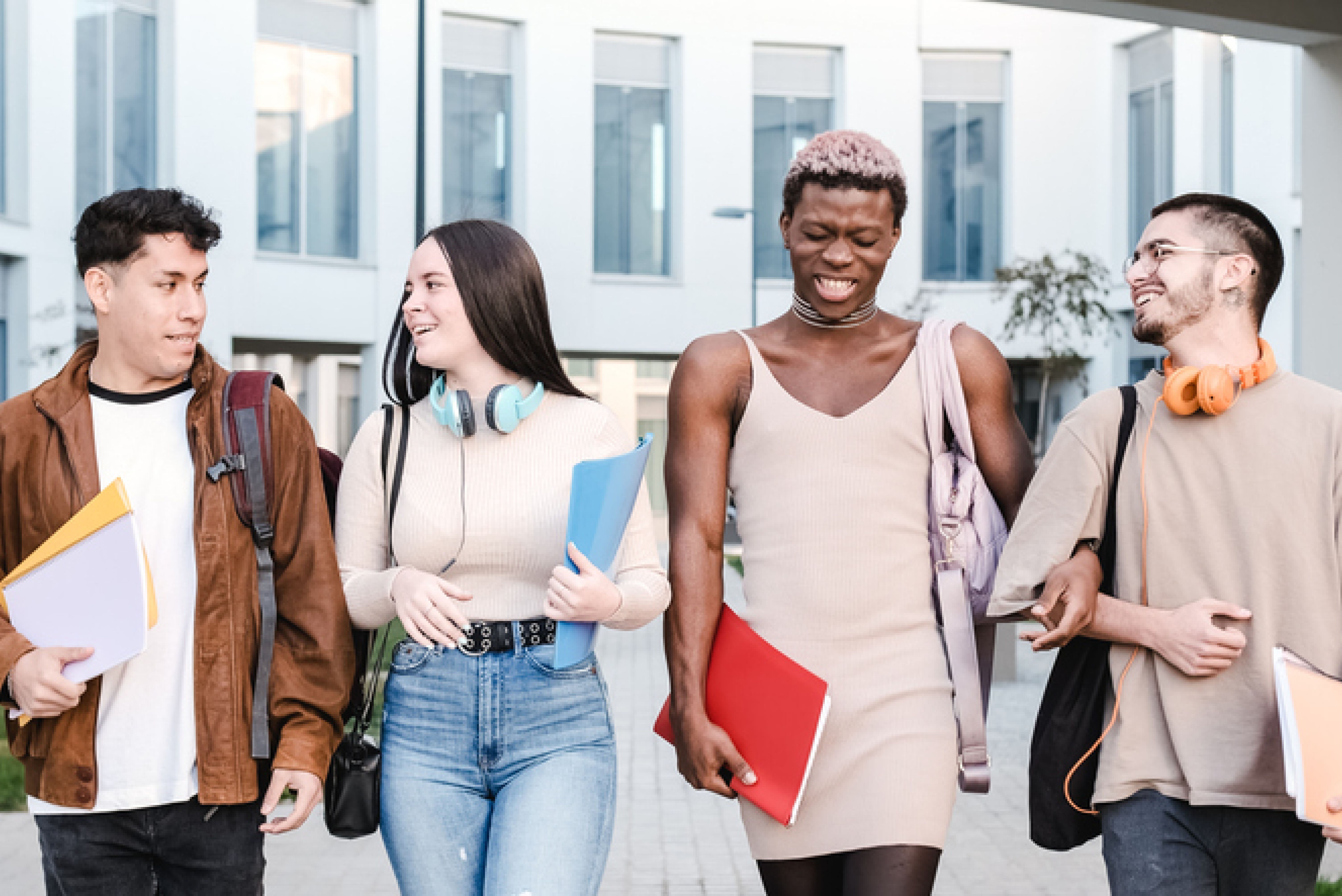 four students walk together