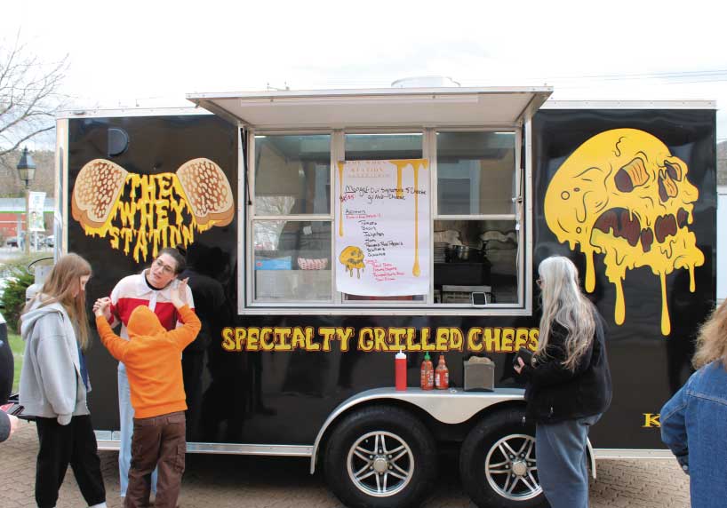 People order from the Whey Station Food Truck