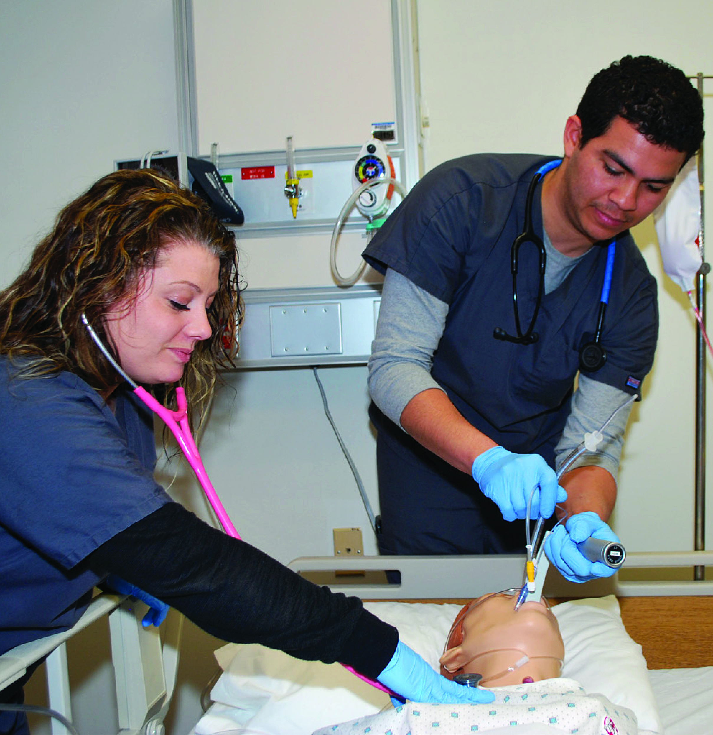 students practice respiratory care on dummy