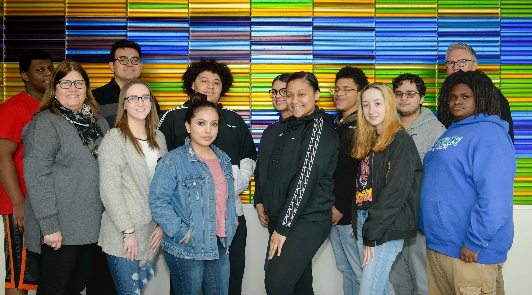 group of students pose and smile at camera