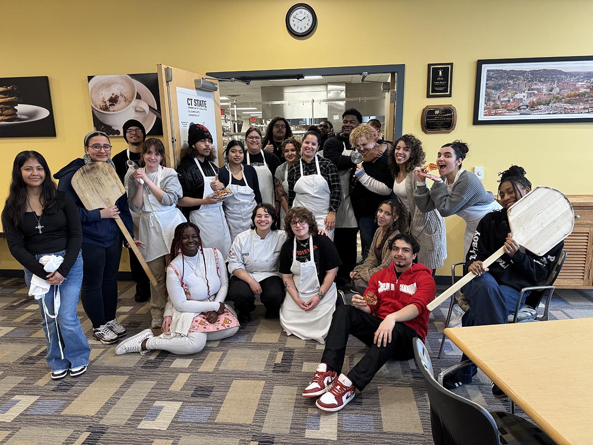 students work together at table on project