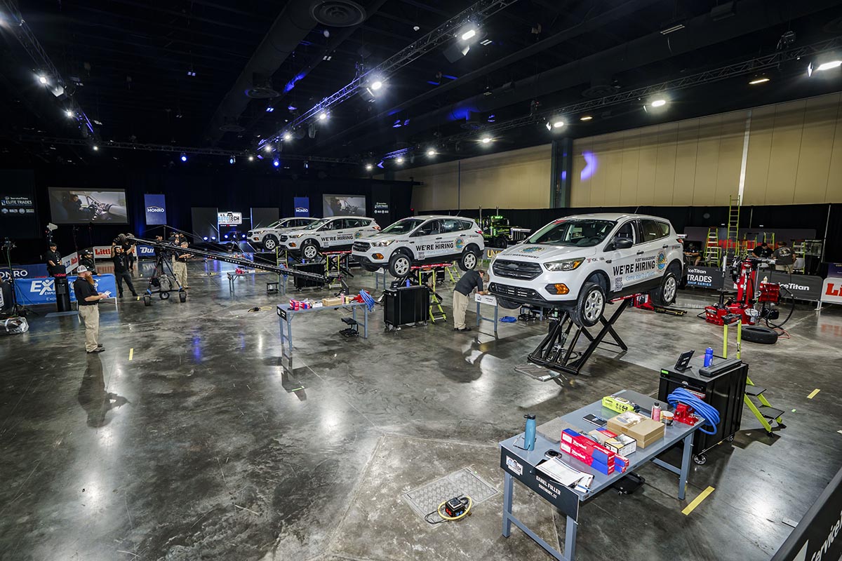 Cars are raised from the ground in the garage.