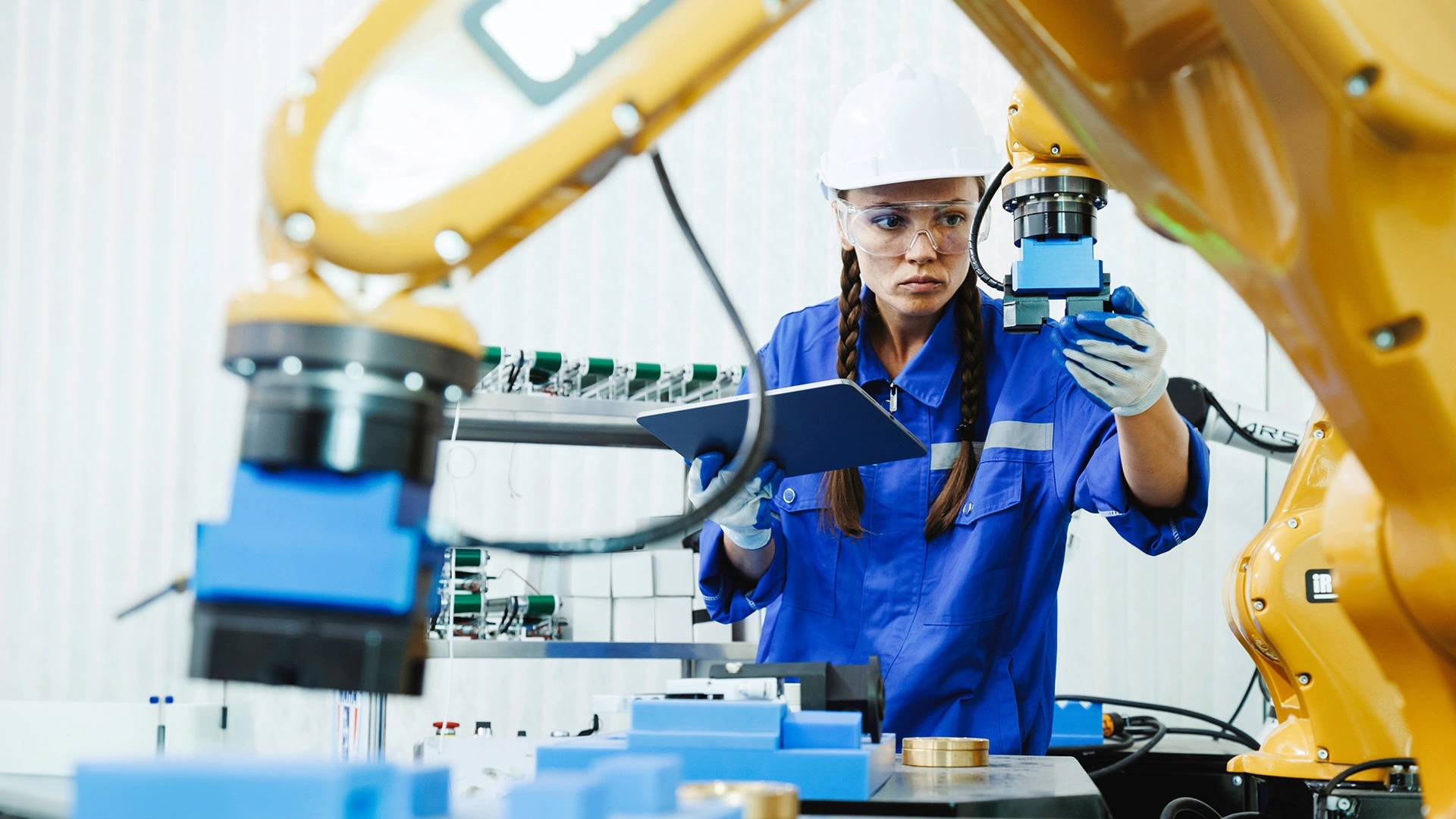 person in manufacturing lab looking at equipment