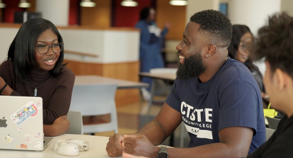 Students talk at table