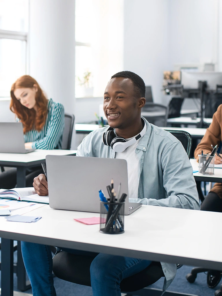 student sits at computer
