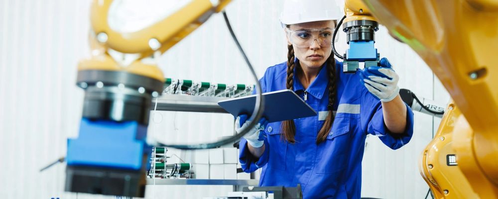 person in manufacturing lab looking at equipment