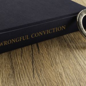 Book that says "Wrongful Conviction on spine