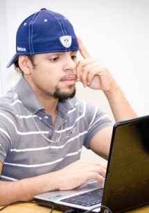 student looks at laptop screen