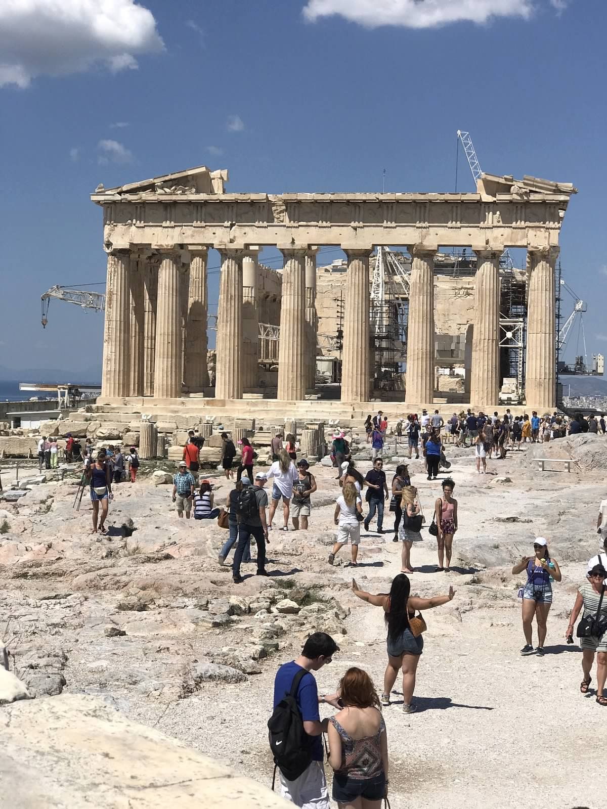 people walking towards monument