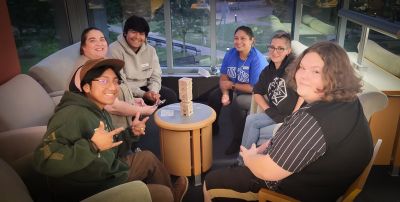 students in group play jenga