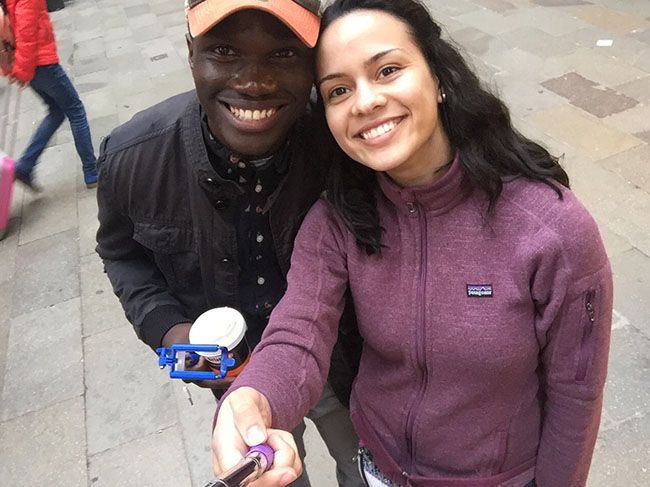 students in Italy smile for selfie