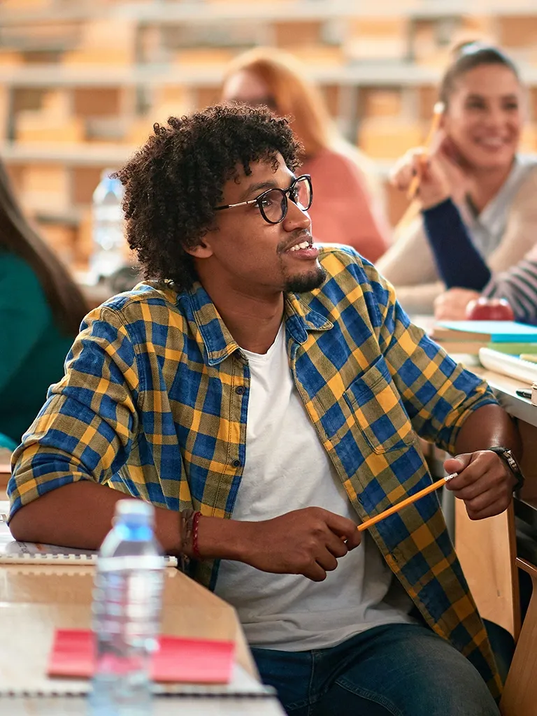 student looks up into corner