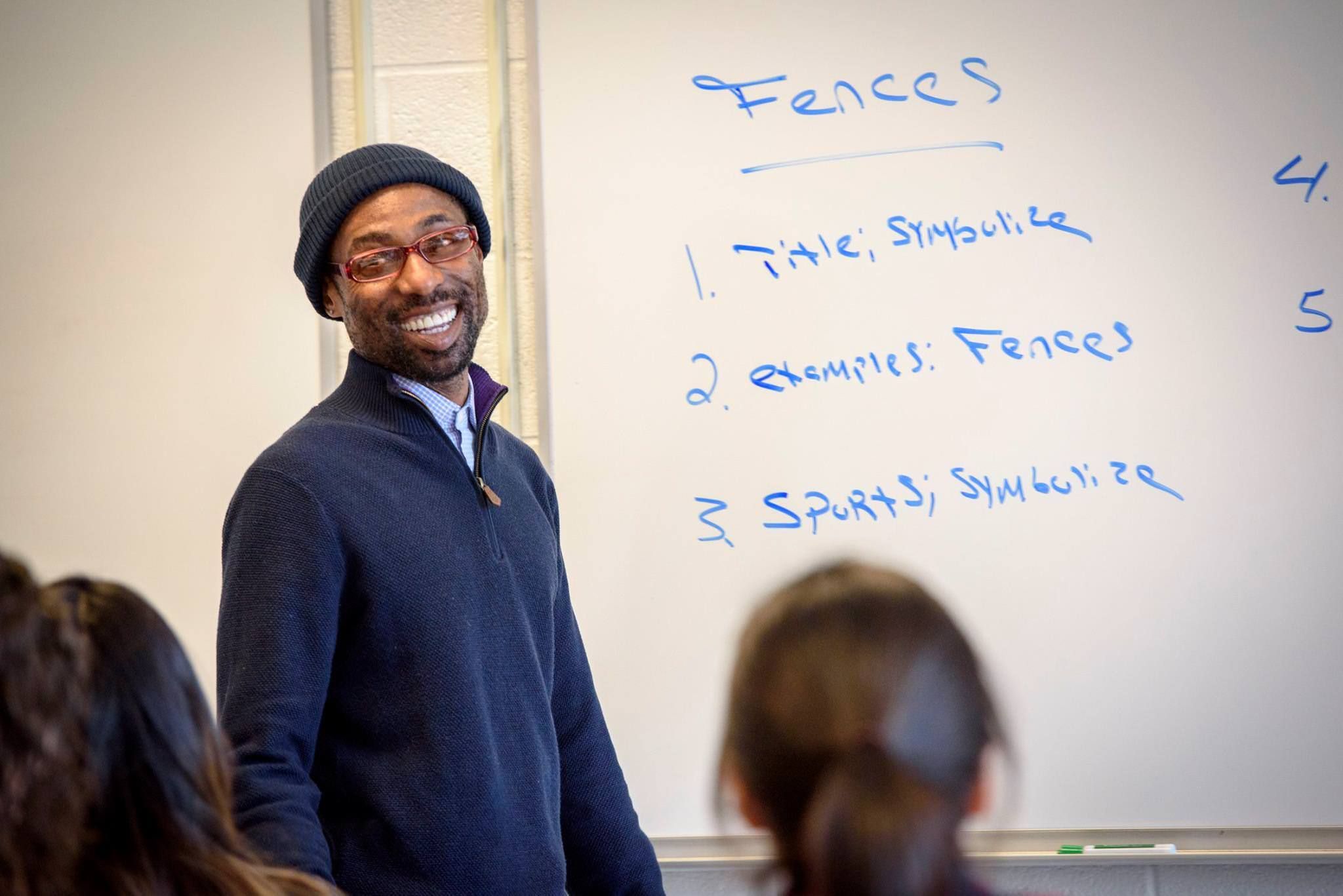 CT State professor interacts with students in class.