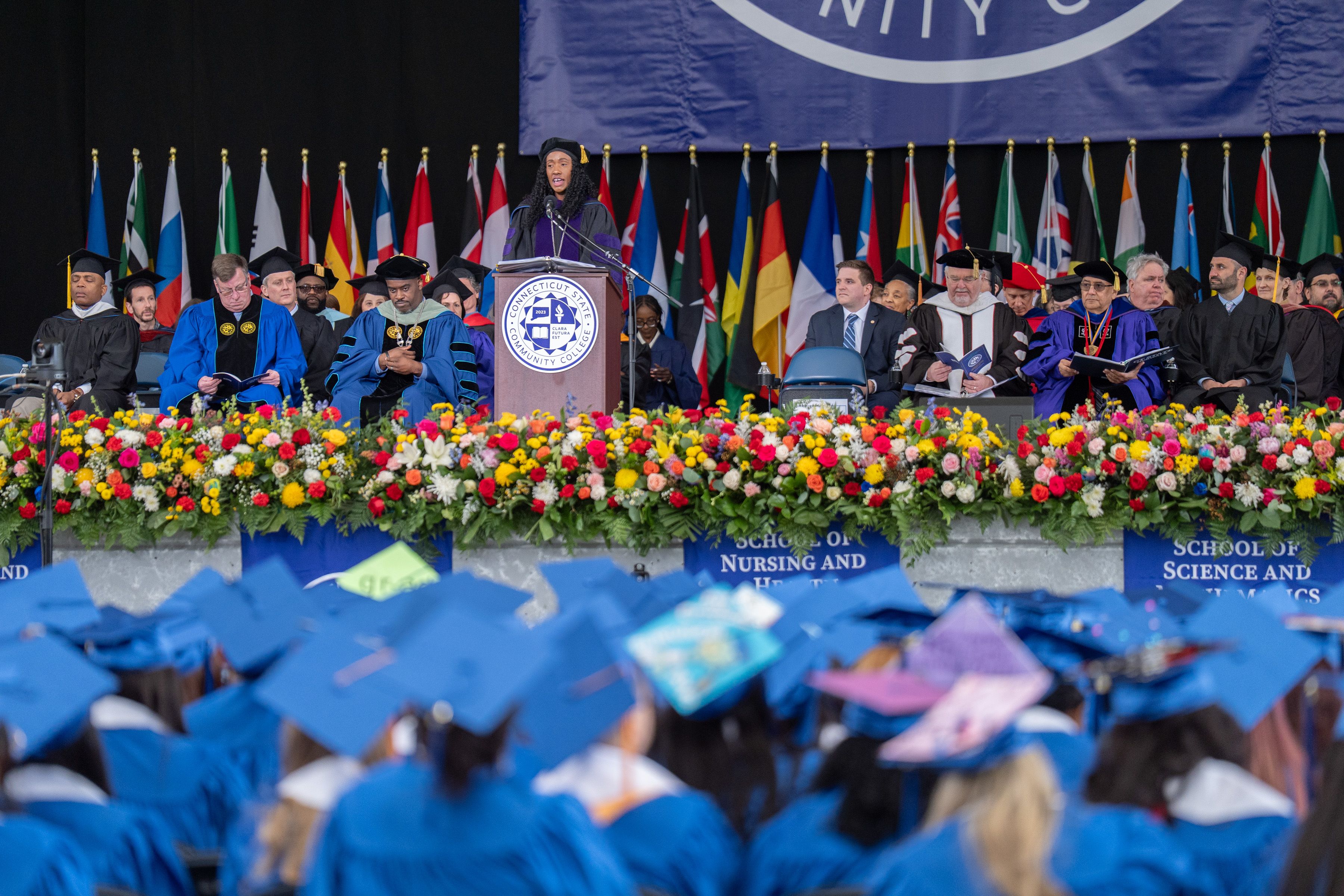 Stage with speaker and dignitaries at commencement ceremony 