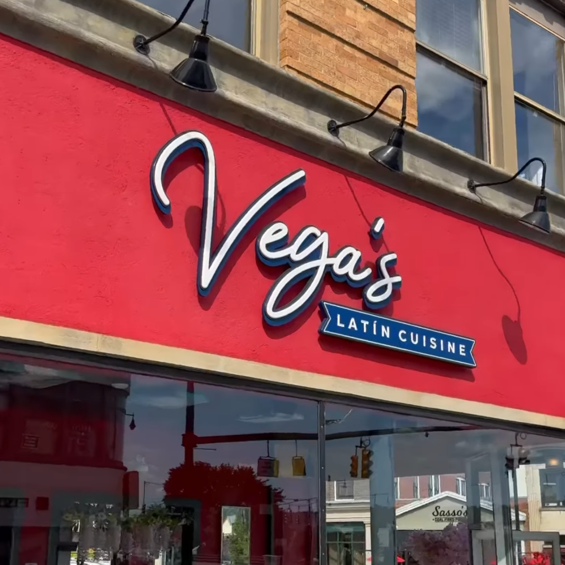 Vegas entrance. Sign reads "Vega's Latin Cuisine"