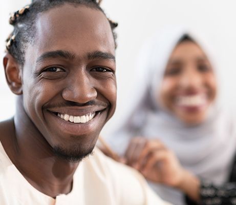 smiling Muslim man and woman