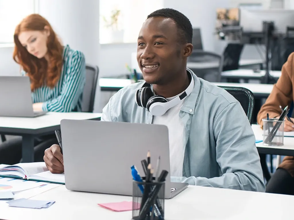 student sits at computer