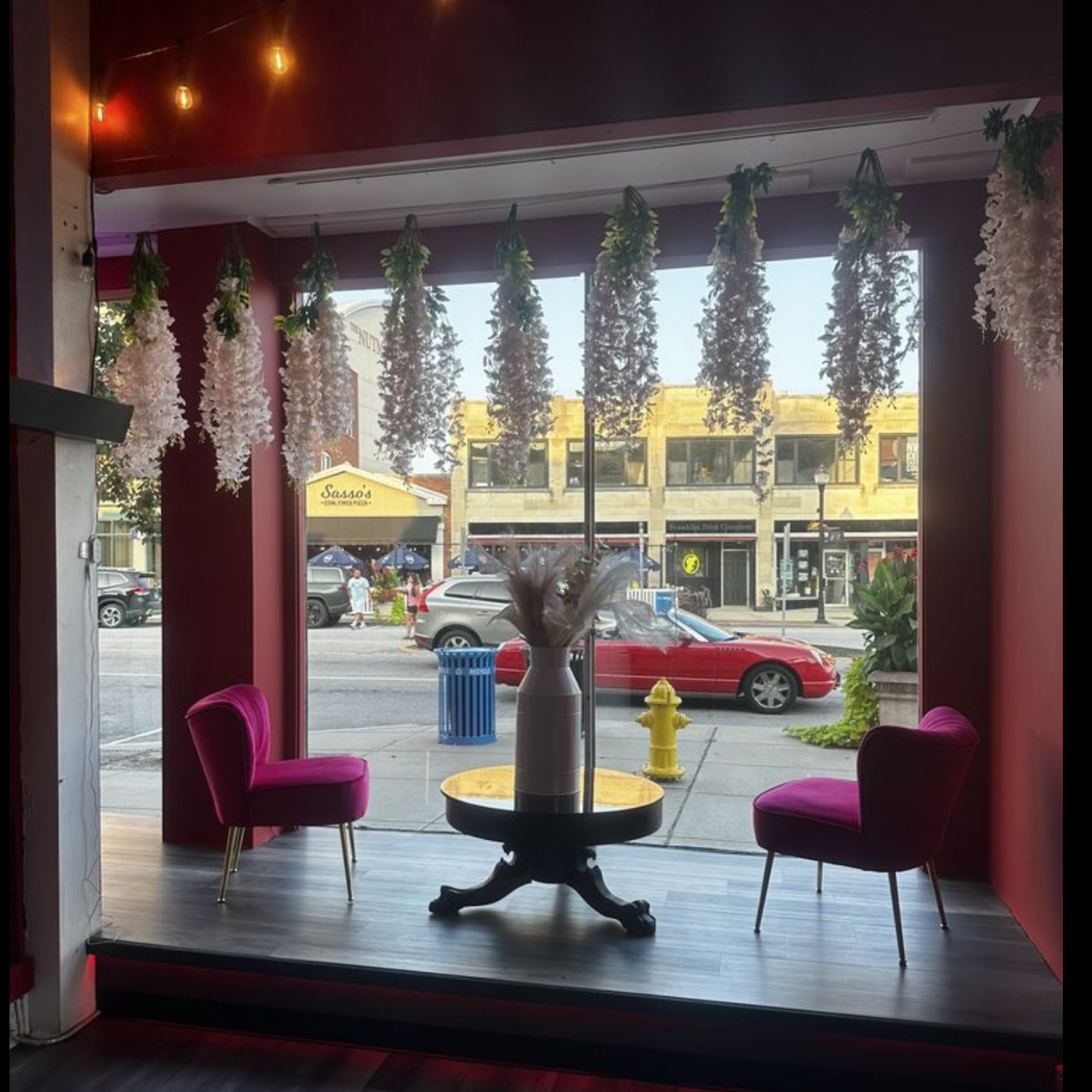 Interior of Vega's restaurant looking out of front window at street.