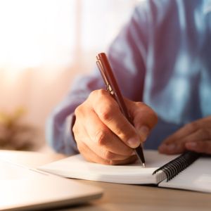 Hand writing in journal.