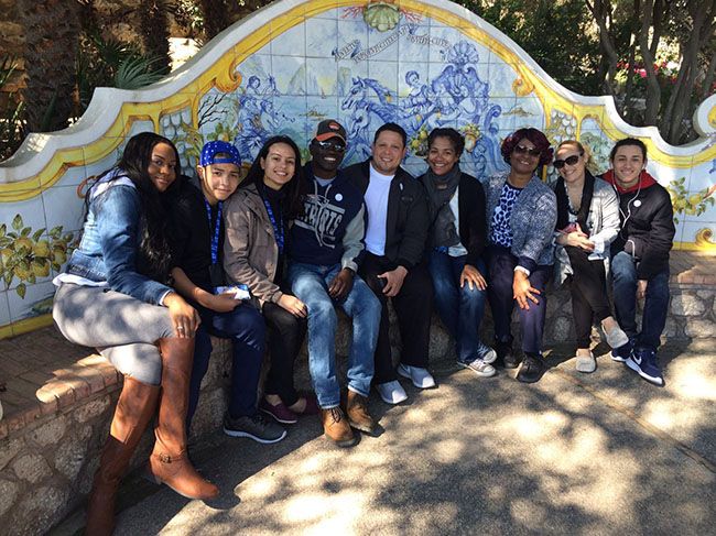 group of students on fancy bench in Italy