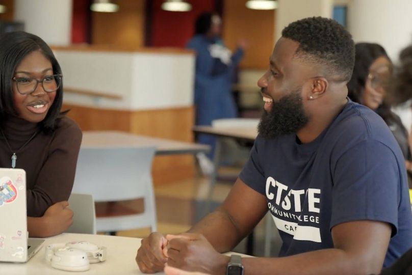 Students talk at table