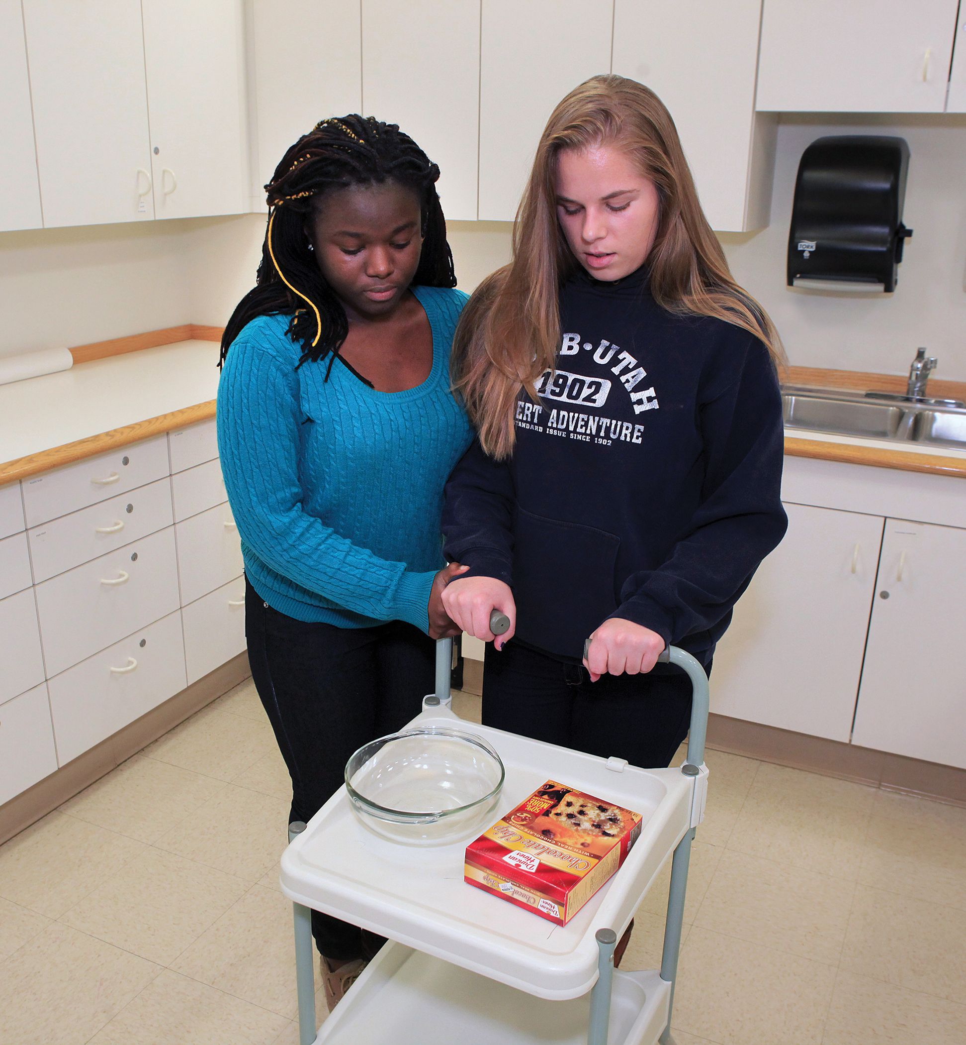 Occupational therapist helps patient walk
