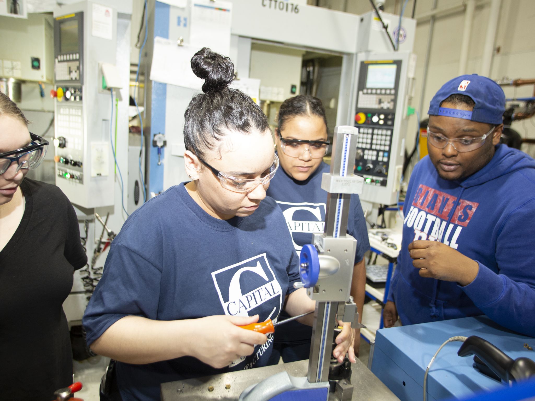 Group of students work in manufacturing lab